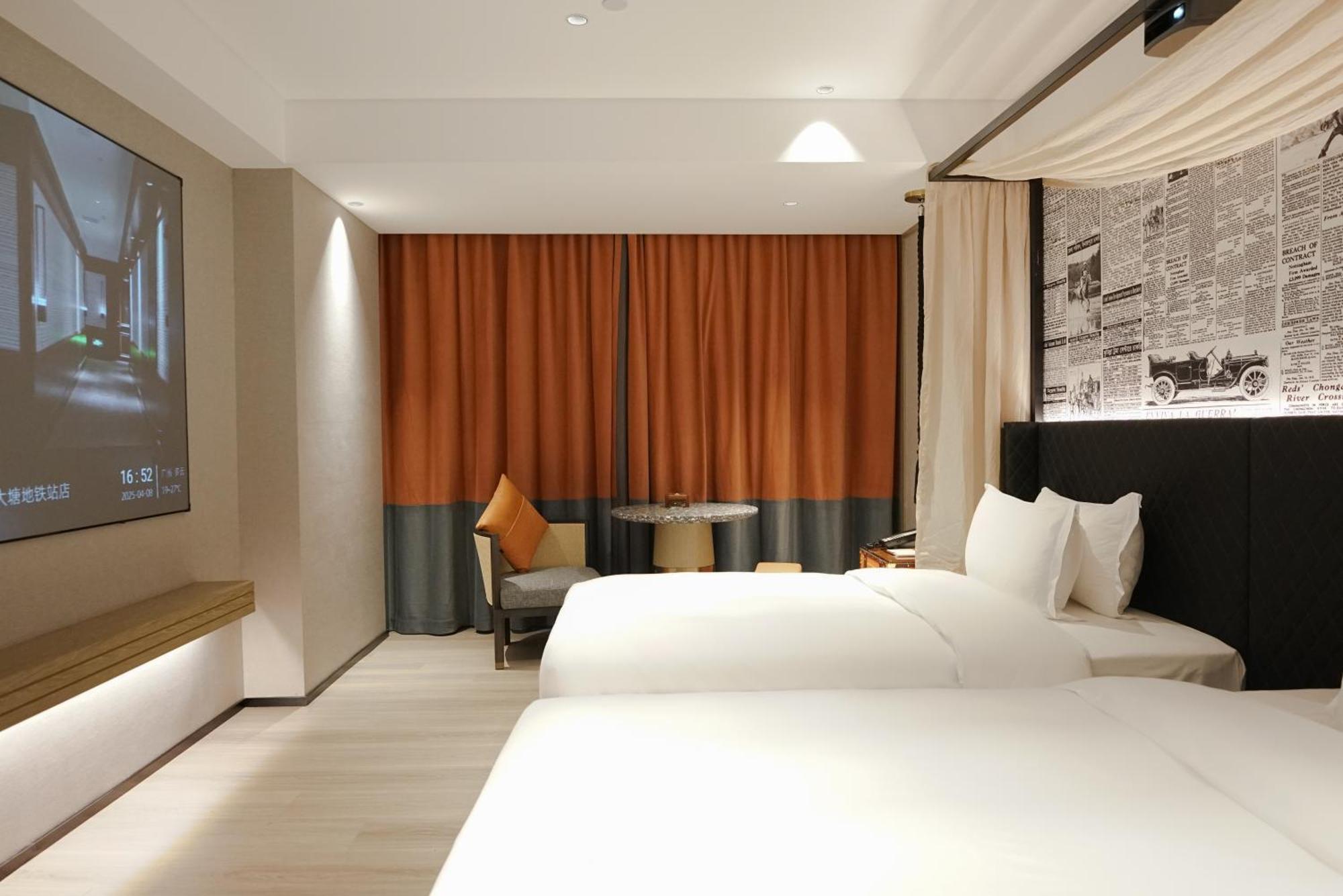 Paco Hotel Datang Metro Canton Esterno foto