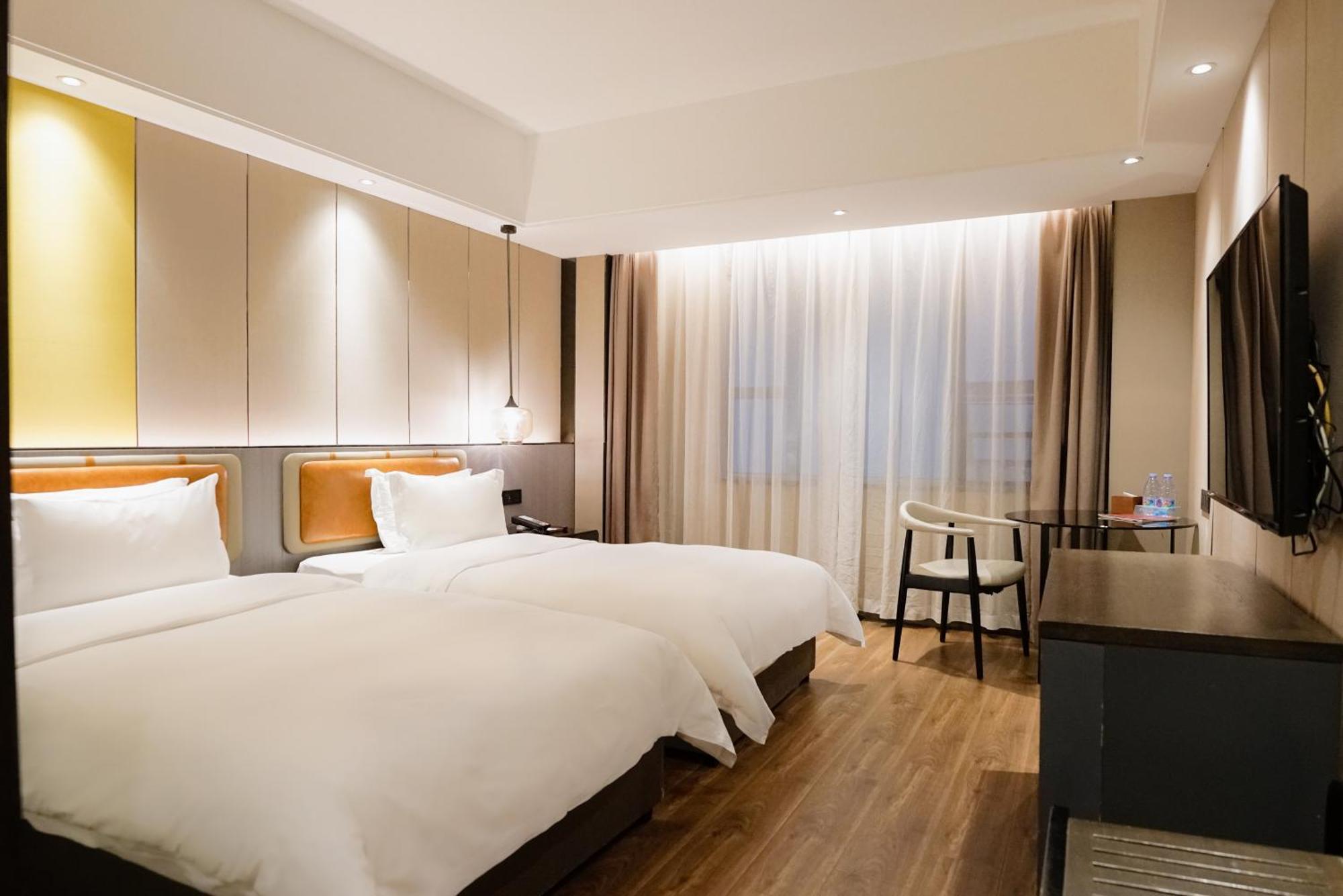 Paco Hotel Datang Metro Canton Esterno foto