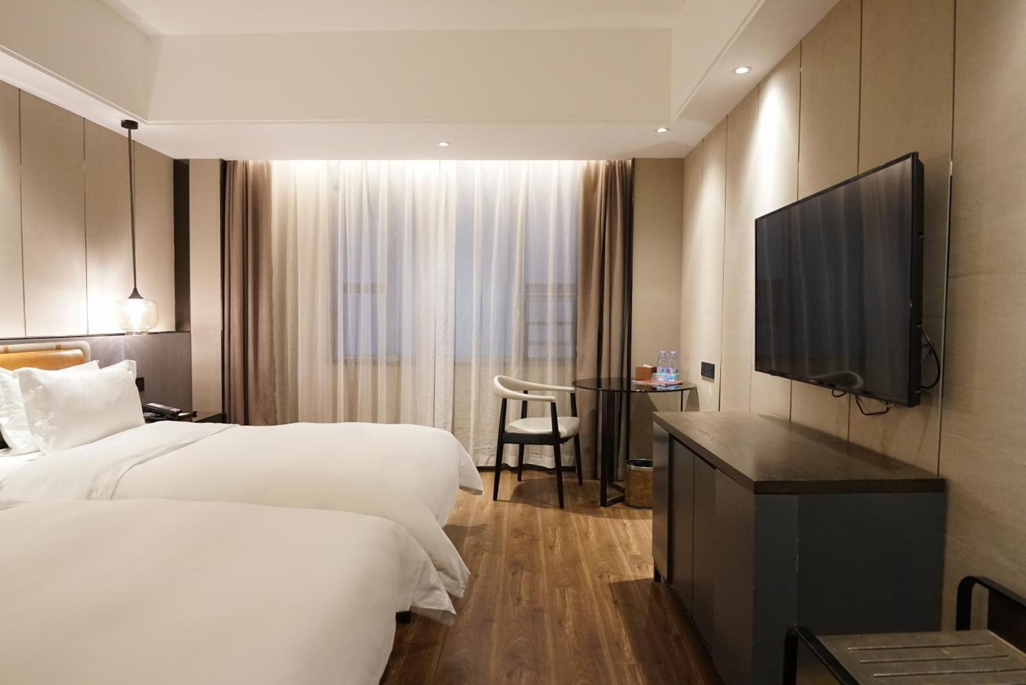 Paco Hotel Datang Metro Canton Esterno foto